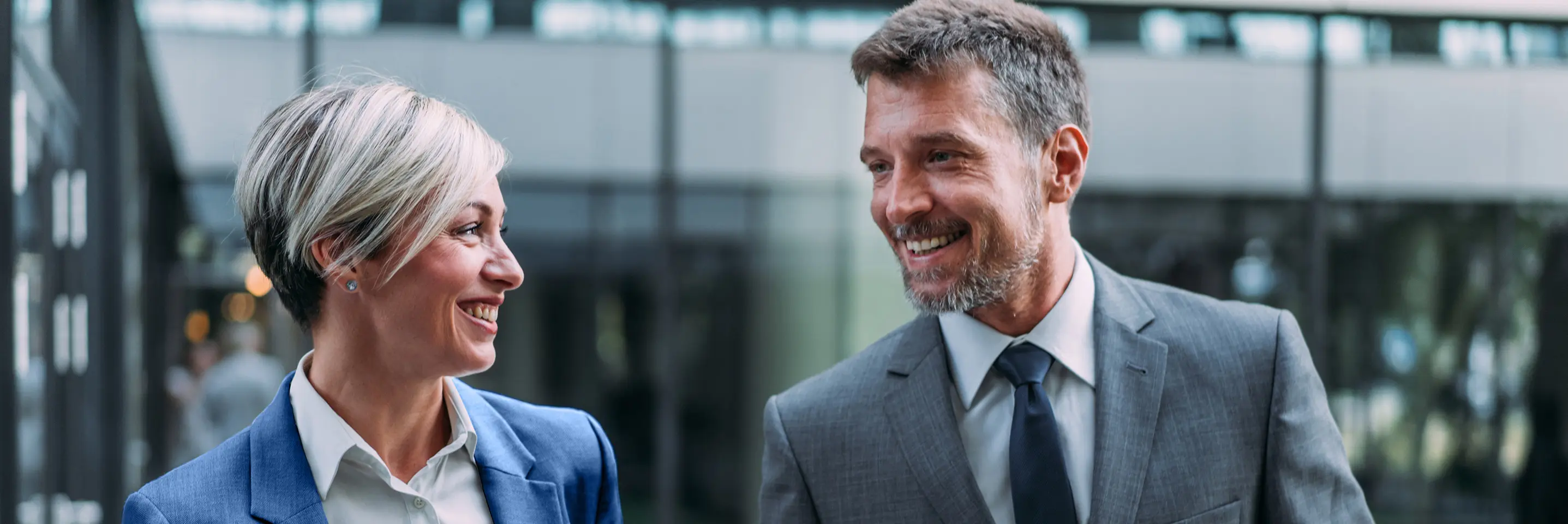 Two experts, a man and a woman in a lively discussion.